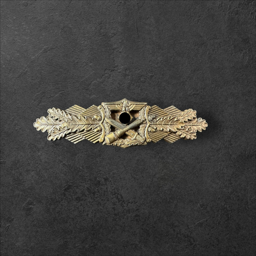 Nahkampfspange in bronze, A.G.M.u.K.